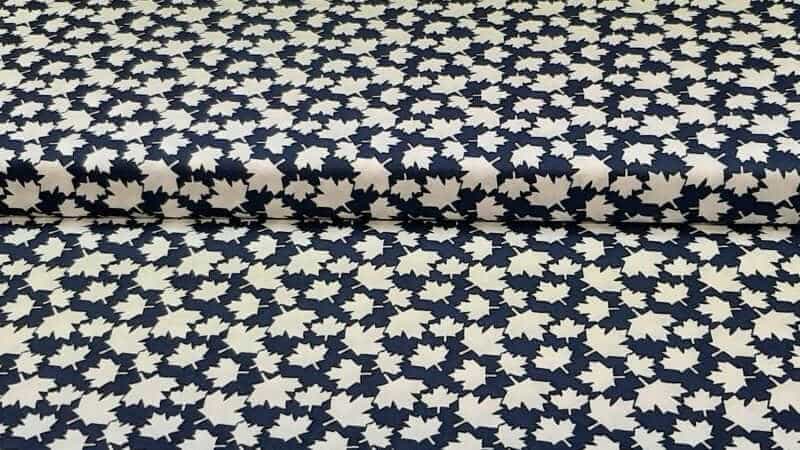 Cotton Fabric In Blue With A Small White Maple Leaf - Christina's Fabrics - Online Superstore. Shop now