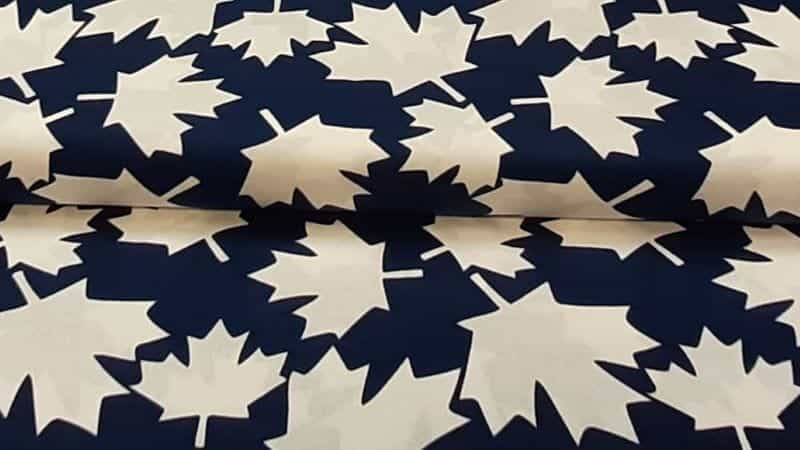 Cotton Fabric In Blue With A White Maple Leaf Print - $5.25 - Christina's Fabrics - Online Superstore. Shop now
