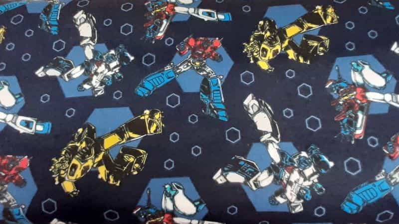 Flannel Fabric In A Navy Blue Hasbro Transformer Print - Christina's Fabrics Online Superstore. Shop now