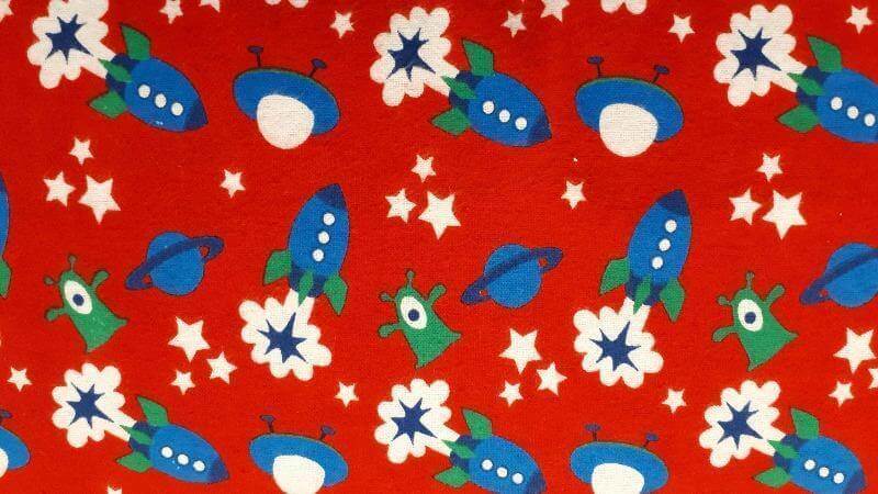 Flannel Fabric In Red With A Spaceship Print - Christina's Fabrics - Online Superstore. Shop now