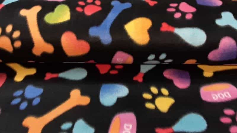 Polar Fleece Fabric In A Black Colorful Pet Print - Christina's Fabrics Online Superstore. Shop now